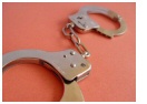 red_bg_handcuffs.jpg