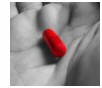 red_pill_in_hand.jpg